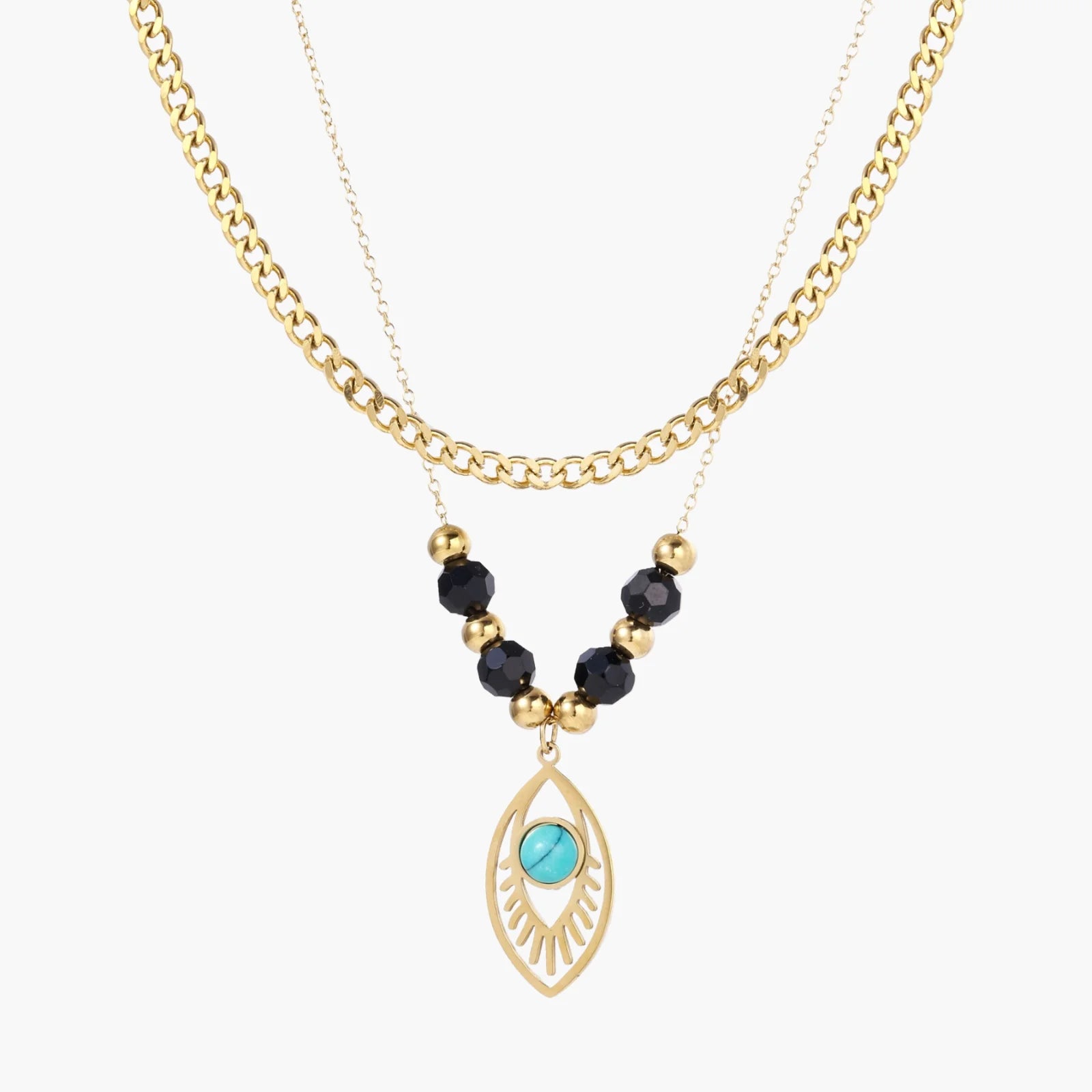 Layered gold necklace with turquoise evil eye pendant and black quartz beads on cream background
