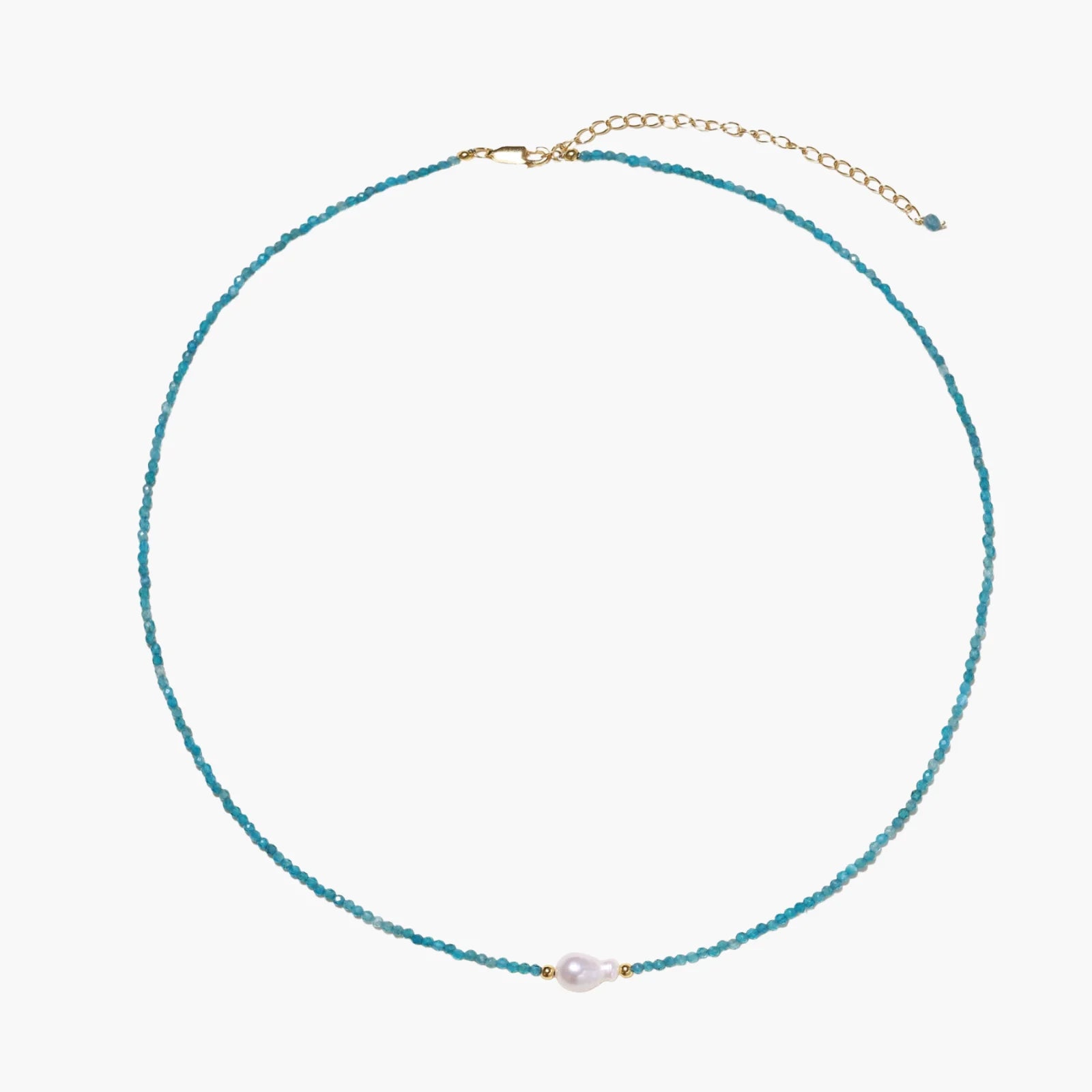 Delicate gold vermeil necklace with teal apatite beads and freshwater pearl on white background.