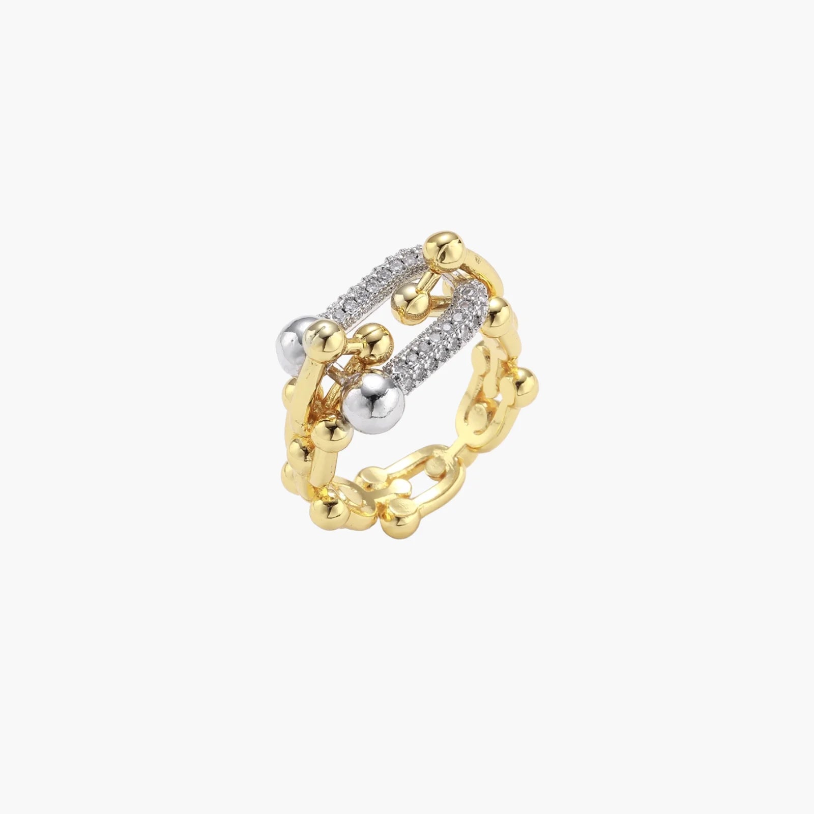 Triple-band gold ring with spherical bead chains and two crystal-pavé bars on cream background
