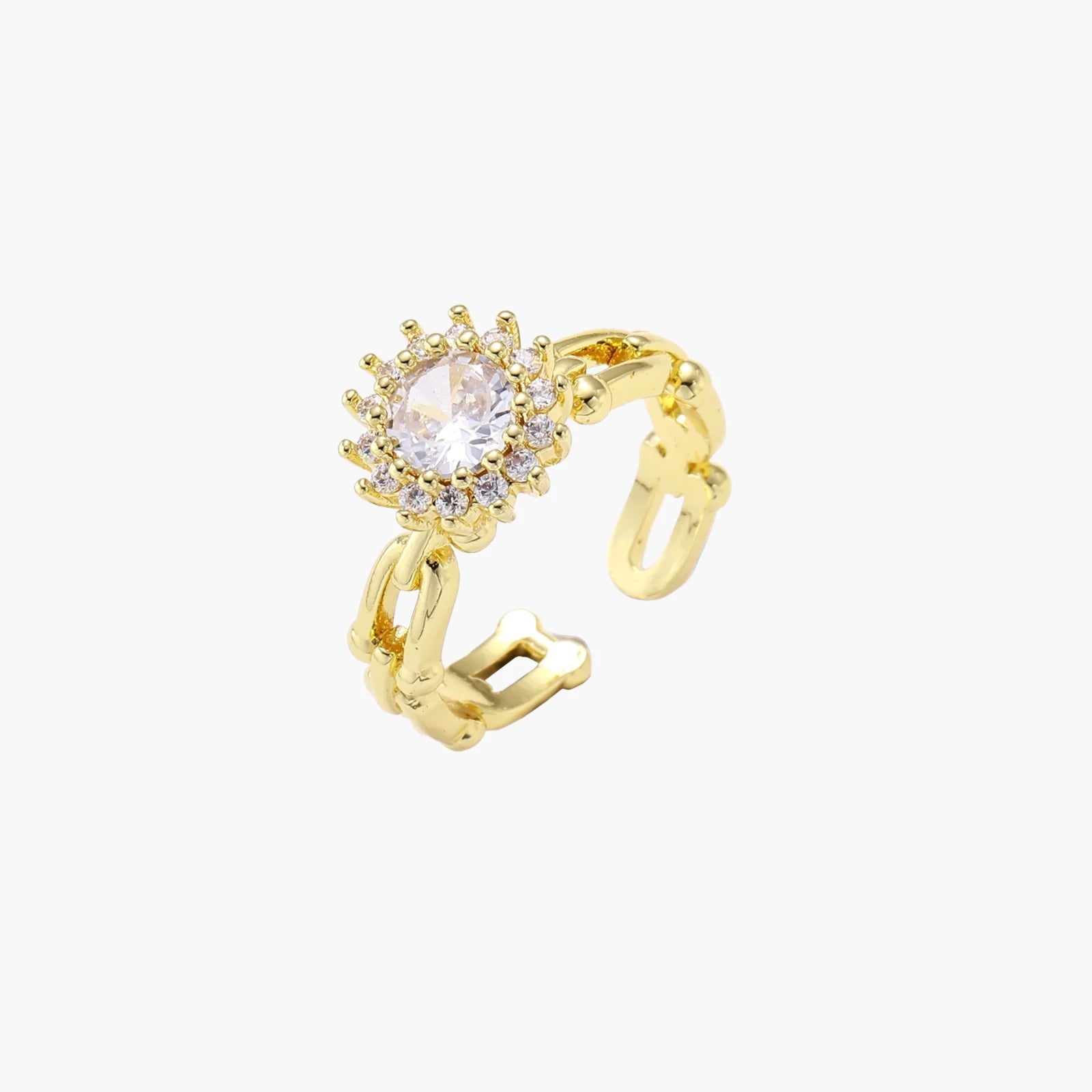 Two adjustable gold rings: chain-link band and halo-style ring with cubic zirconia stones on cream background