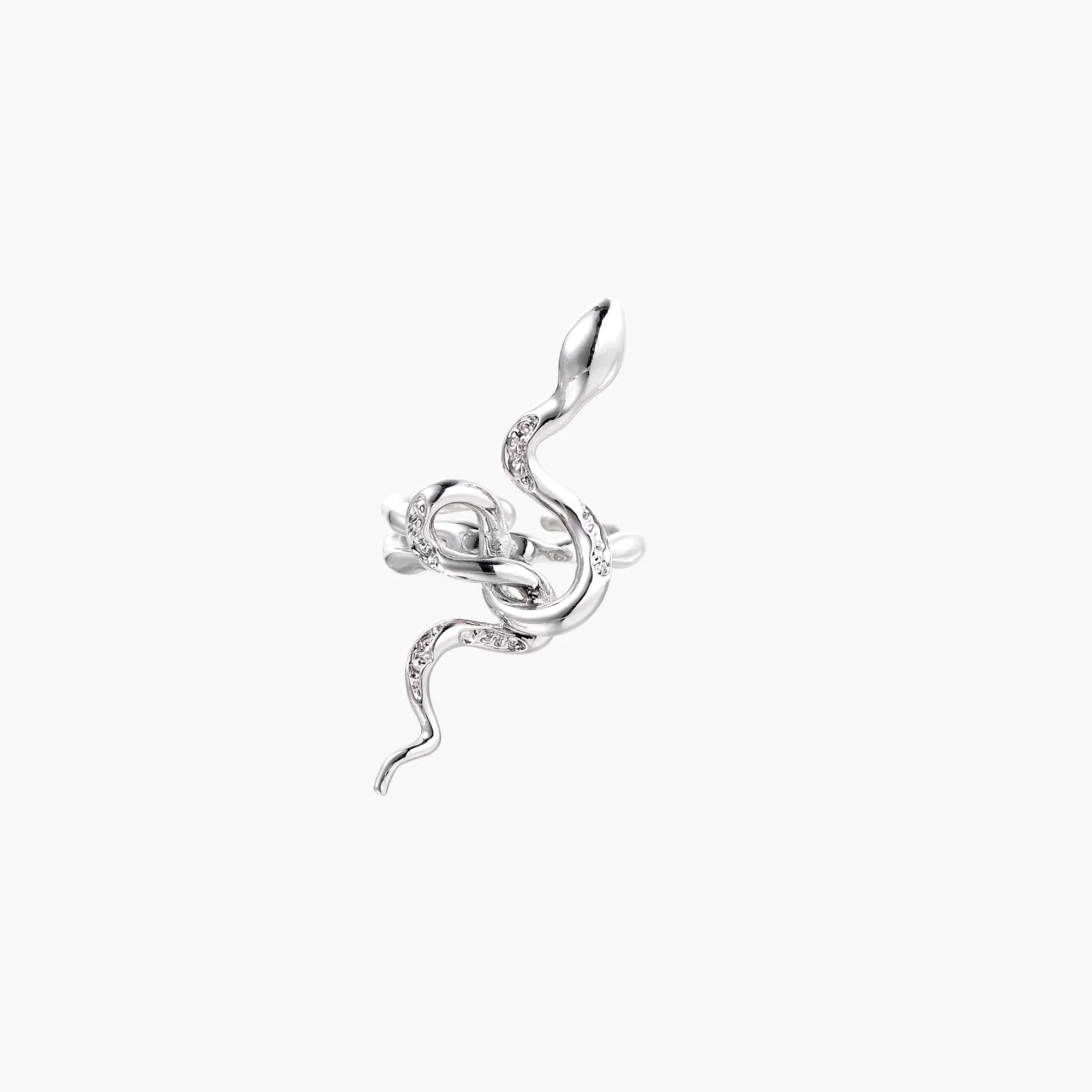 Sculptural white gold-plated snake ring with crystal accents coiling around finger in bold open design