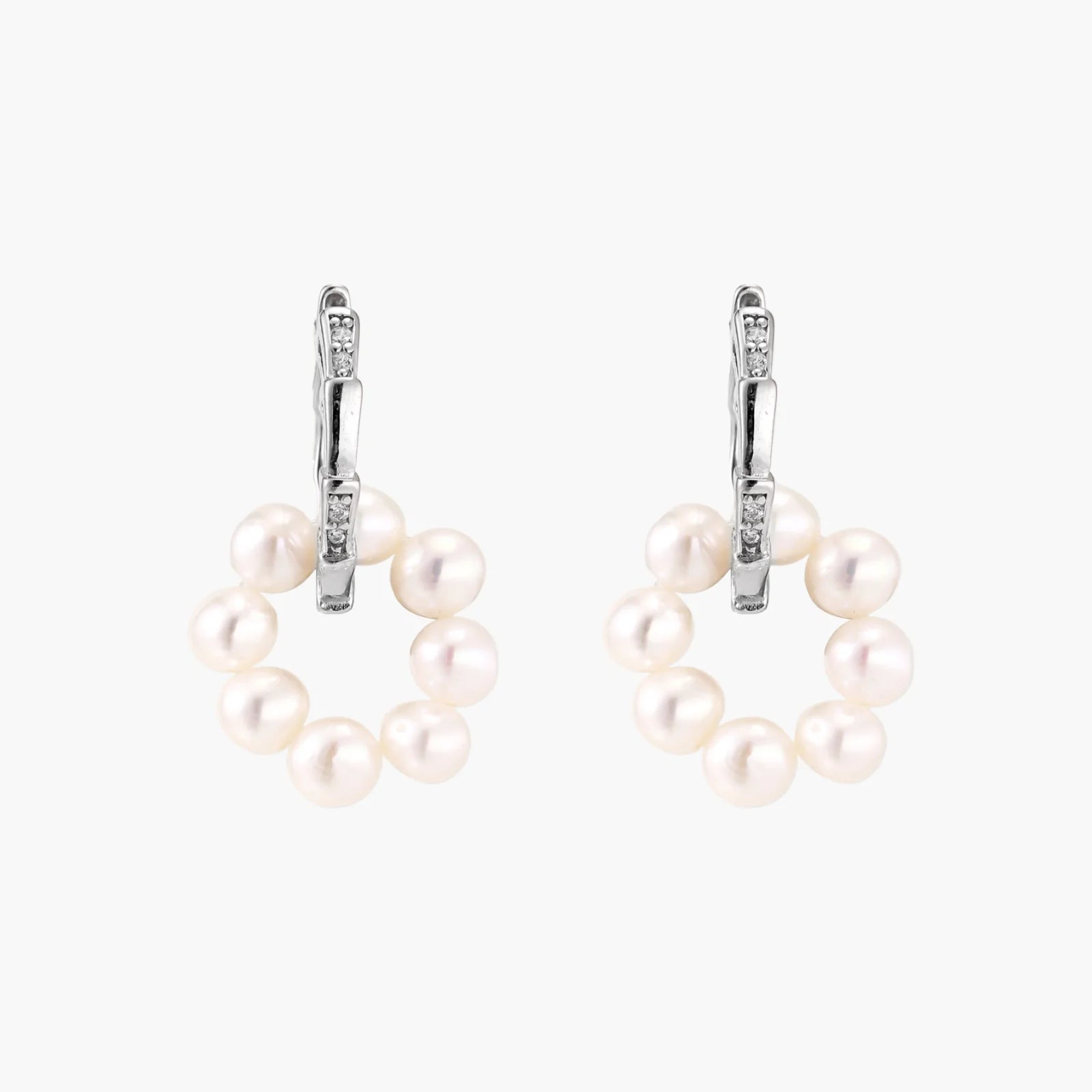 Rhodium-plated silver hoop earrings with freshwater pearls arranged in crescent formation and diamond accents