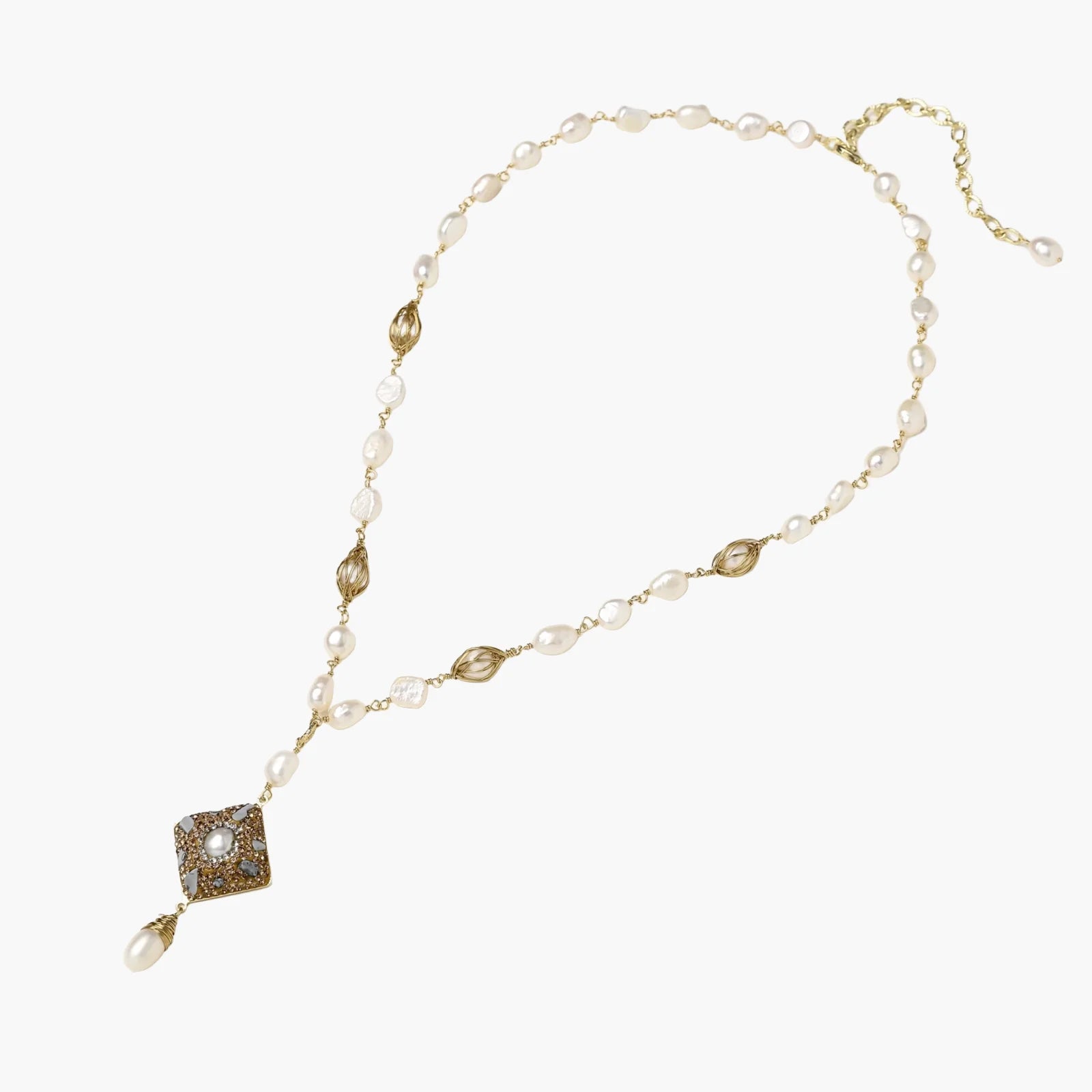 Y-shaped necklace with freshwater pearls, gold filigree stations, and ornate diamond-shaped centerpiece with pearl drop