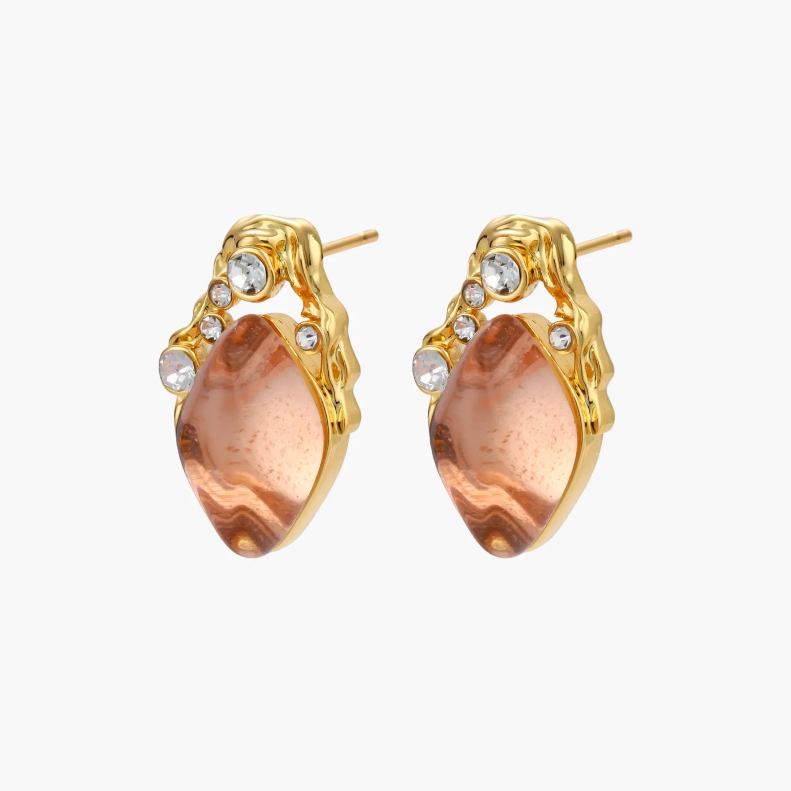Gold-plated baroque stud earrings with coral-pink liuli stones and cubic zirconia crystals on white background.