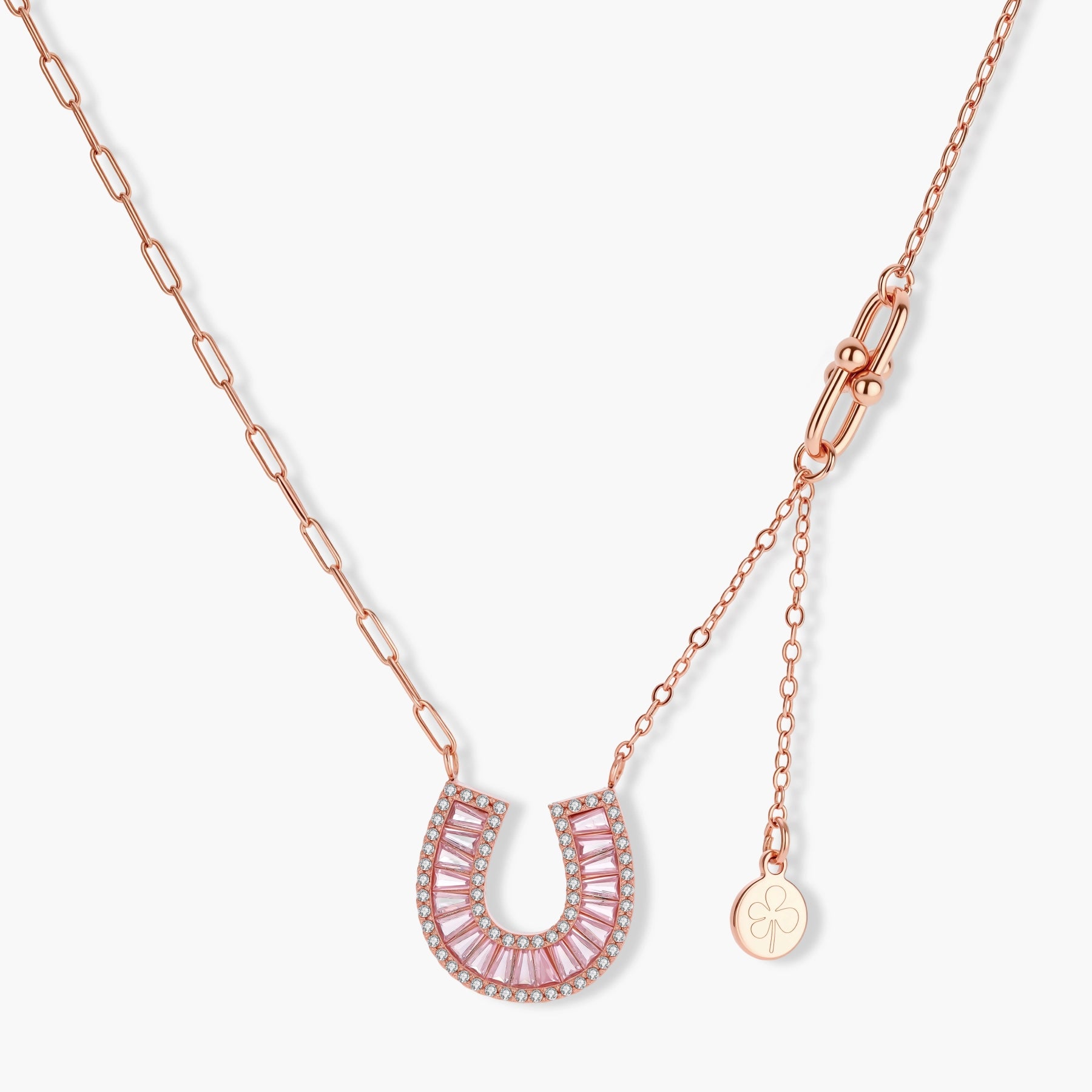 Sparkling horseshoe-shaped jewelry set with AAA cubic zirconia in gold-plated and white gold finishes on cream background.