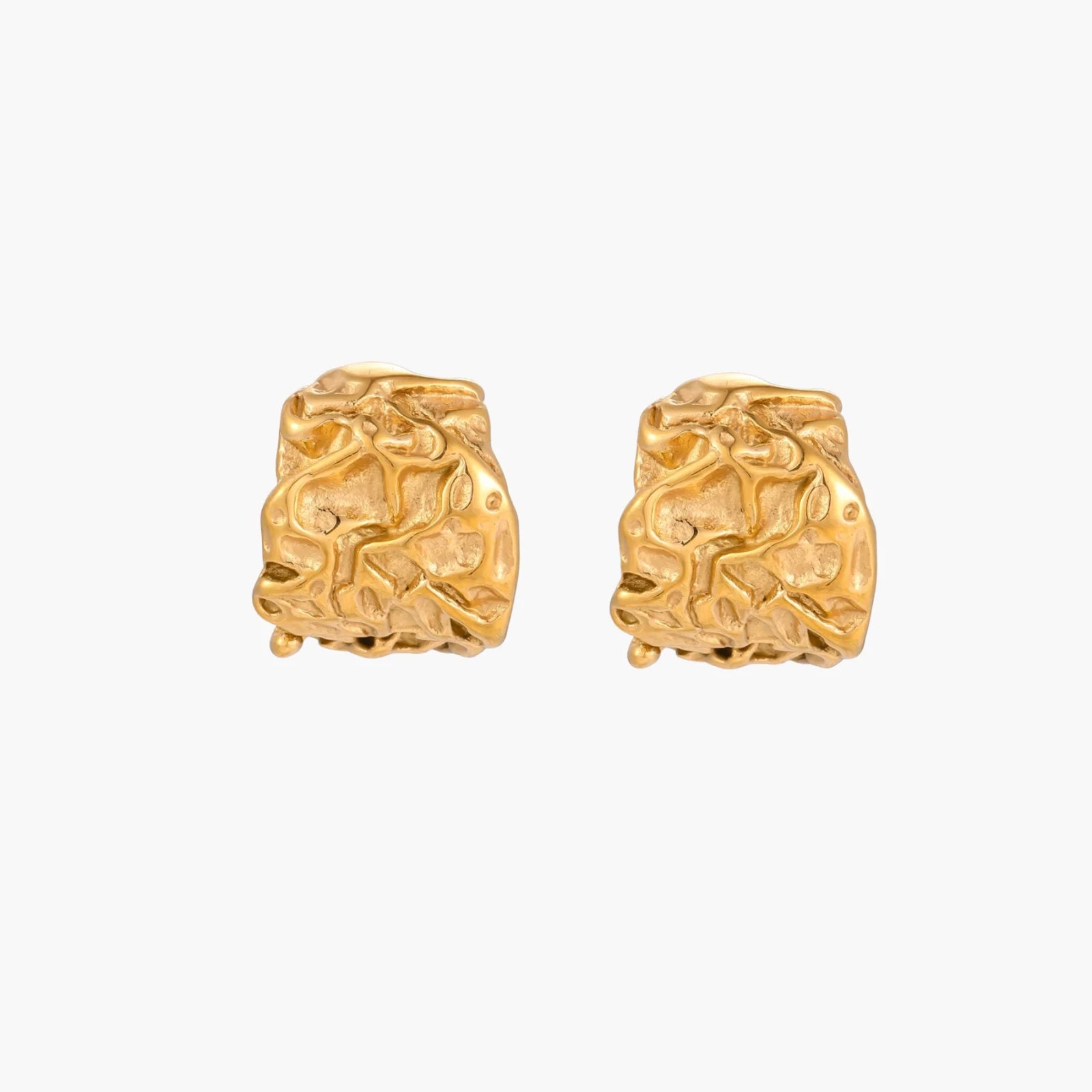 Sculptural gold-plated hoops with organic crushed texture on cream background