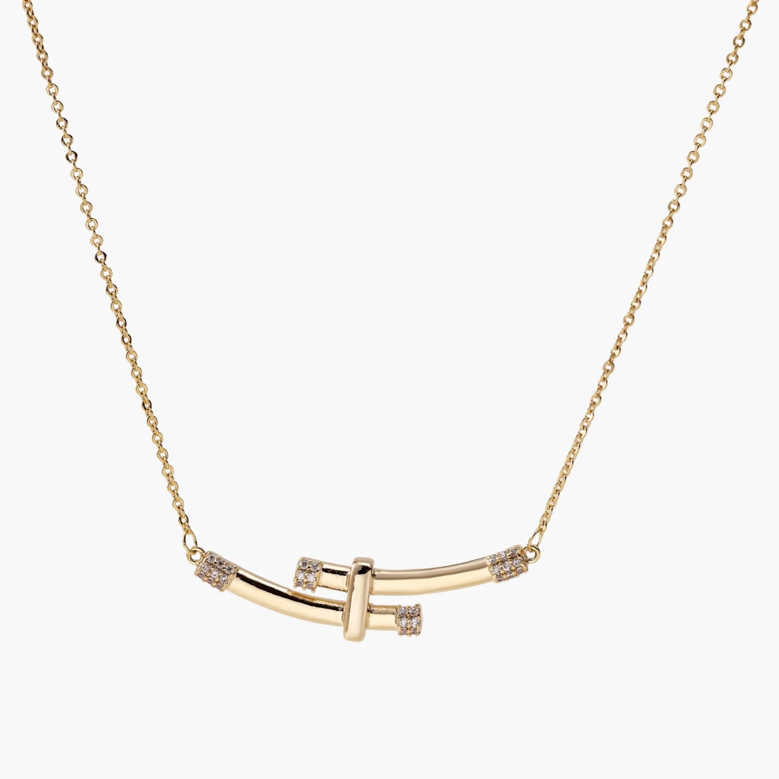 Gold-plated curved bar necklace with diamond accents on delicate chain against cream background