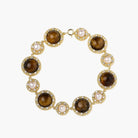 Gold-plated link bracelet with alternating brown tiger's eye stones and white freshwater pearls in ornate bezels.