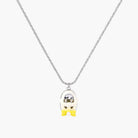 Chrome egg-shaped pendant with kawaii face, yellow bow, and pearl detail on silver chain against white background