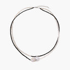 Double-strand necklace with black faceted quartz and white pearls featuring an oversized baroque pearl centerpiece