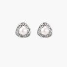 Triangular white gold plated stud earrings with central freshwater pearl and baguette-cut stones on white background