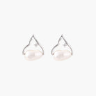 Silver mountain outline studs with baroque pearl and diamond accent on white background