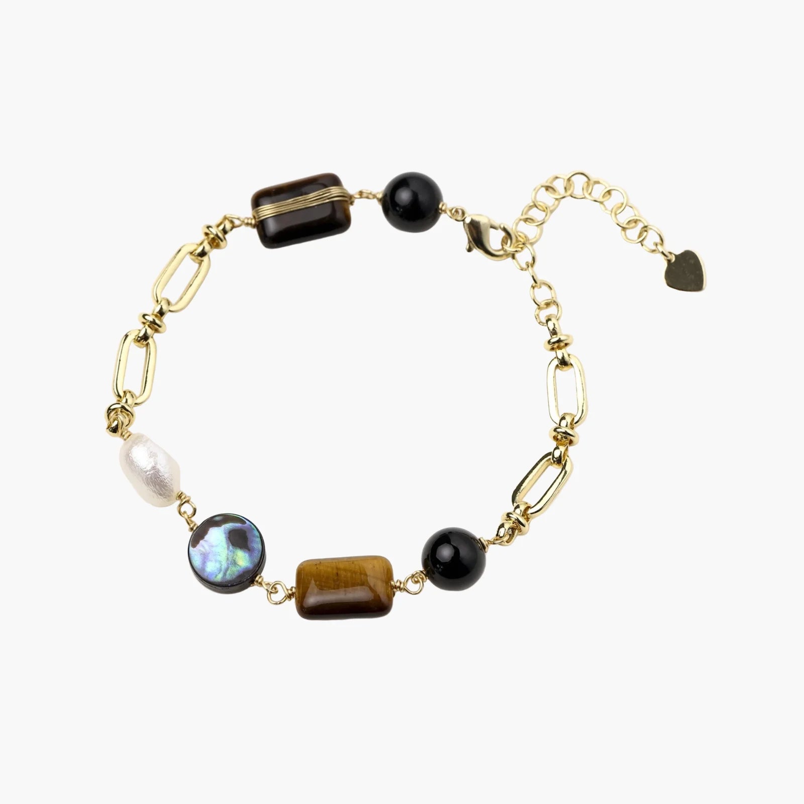 Gold chain bracelet with tiger's eye, obsidian, pearl, and iridescent abalone stones on cream background.