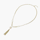 Long gold-plated necklace with freshwater pearls, chunky chain links, and flowing tassel pendant