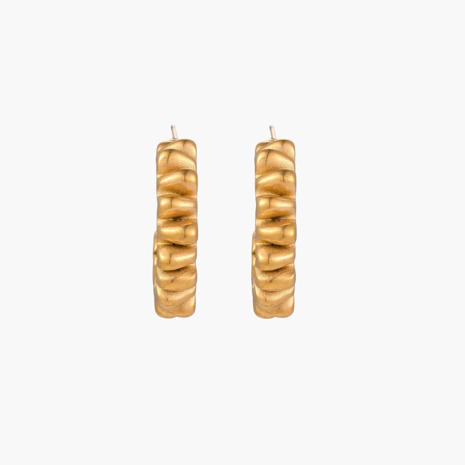 Sculptural gold-plated hoop earrings with continuous twisted spiral design on cream background