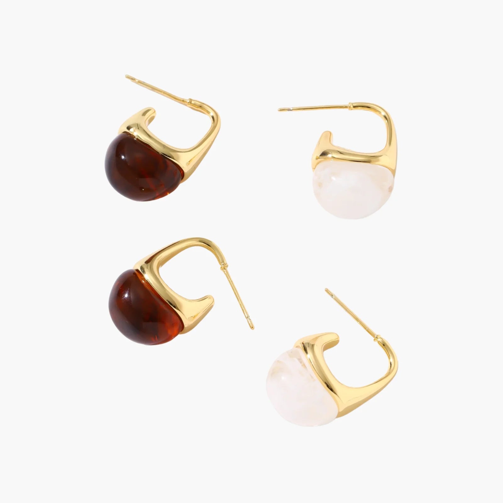 Modern drop earrings with curved gold-plated copper tops and amber resin bottoms creating an organic teardrop silhouette.