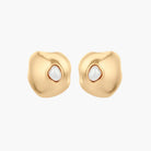 Organic-shaped eco-zinc alloy stud earrings with resin pearl centers and sterling silver posts on white background.