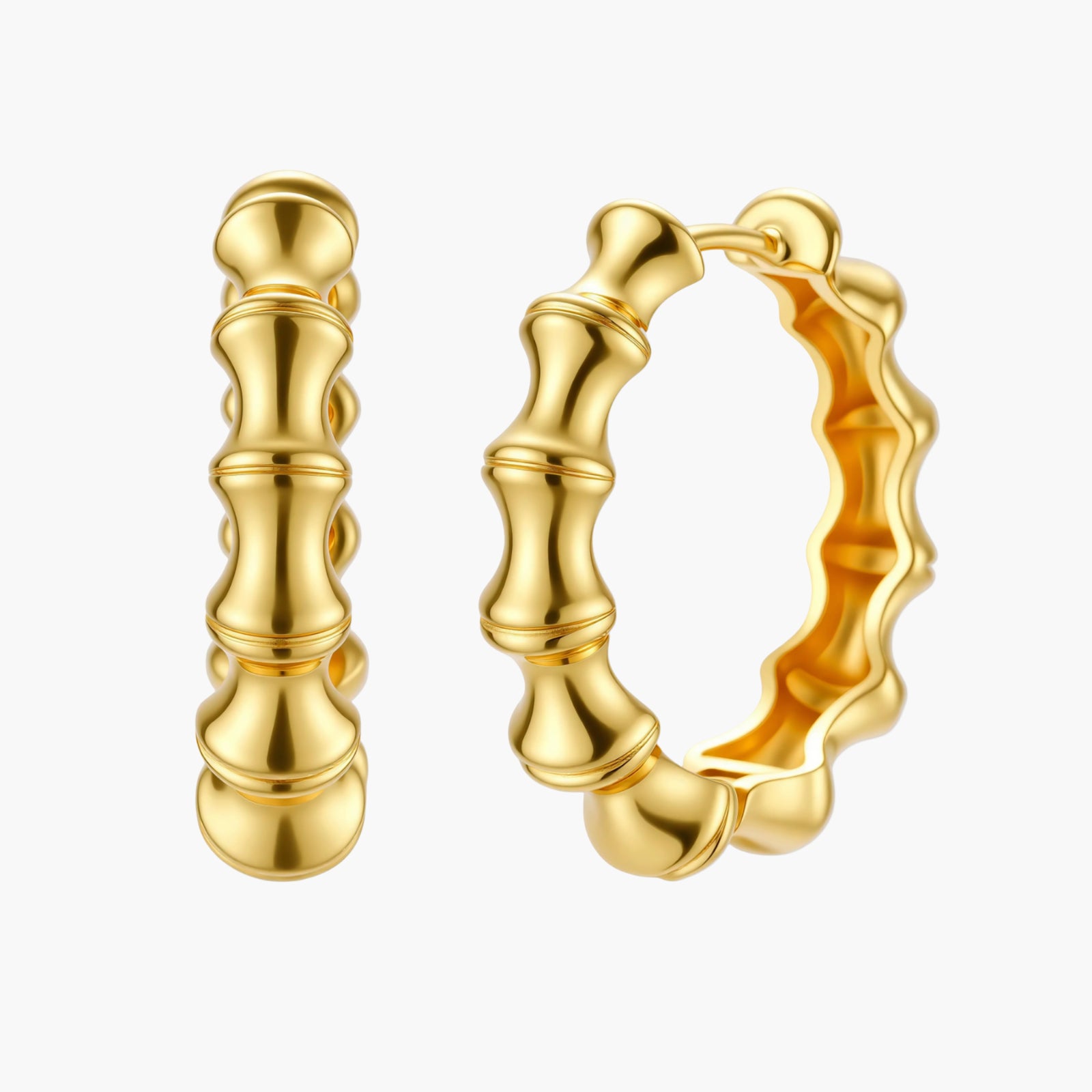 Close-up of gold-plated sterling silver hoop earrings with bamboo-inspired segmented design on white background.