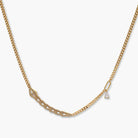 Gold-plated necklace with geometric diamond segments and matching huggie earrings featuring cubic zirconia details