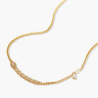 Gold-plated necklace with geometric diamond segments and matching huggie earrings featuring cubic zirconia details
