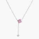White gold plated jewelry set with pink cubic zirconia stones in geometric cross design, featuring Y-necklace and square stud earrings